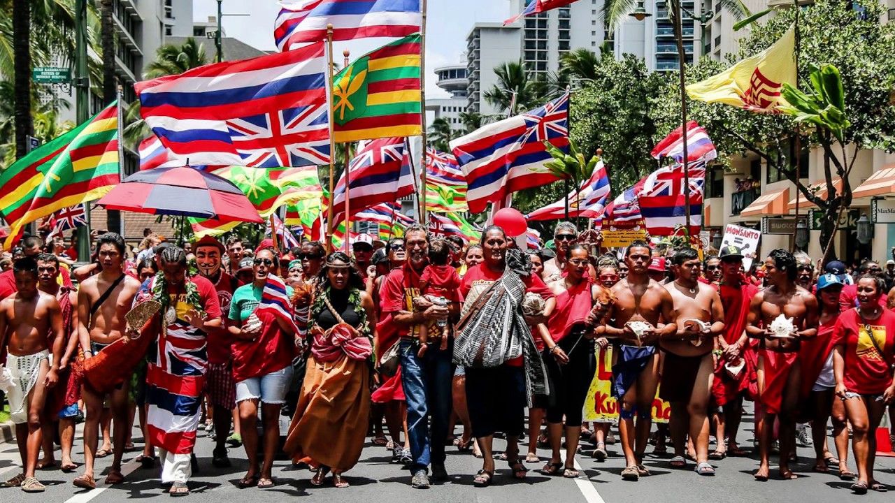 Hawaiian community members marching for the protection and sovereingty of the ʻāina.